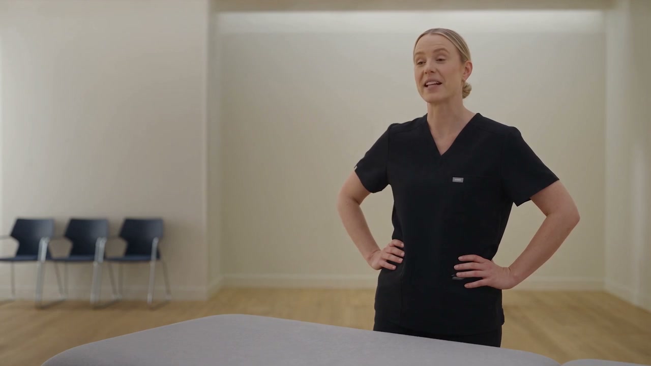 Bridie Callanan standing in the treatment room at Second Creek Physiotherapy